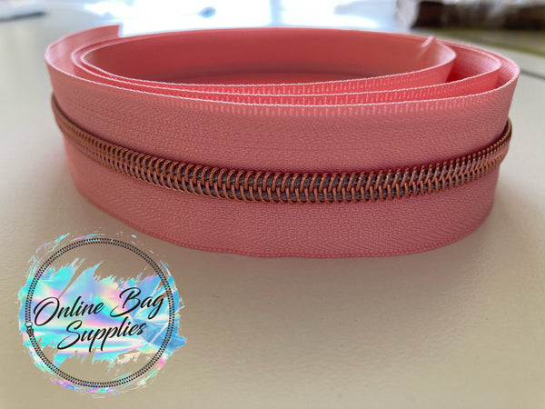 Rose gold on peachy pink zipper tape