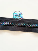 Iridescent with black number 5 zipper tape