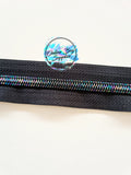 Iridescent with black number 5 zipper tape