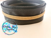 Antique brass with black number 5 zipper tape