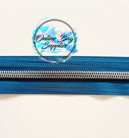 Gunmetal with teal number 5 zipper tape