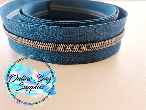 Gunmetal with teal number 5 zipper tape