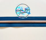 Rose gold with teal number 5 zipper tape