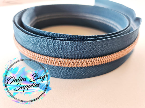 Rose gold with teal number 5 zipper tape