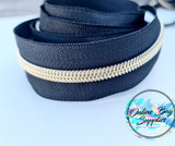 Gold with black zipper tape